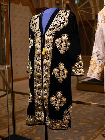 An embroidered ceremonial garment displayed inside the palace.