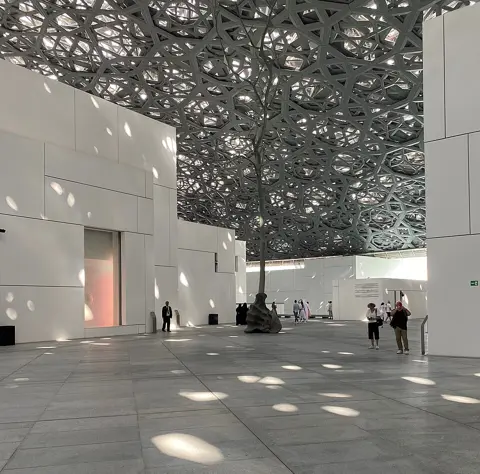 Dappled light falls through the museum’s patterned dome.