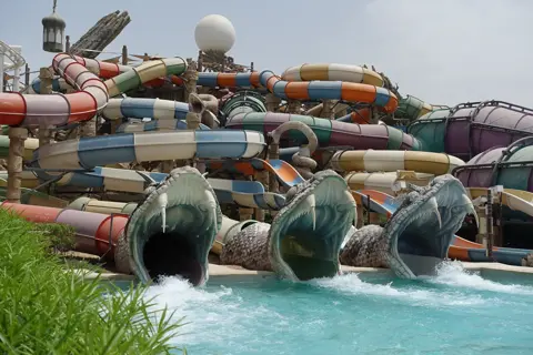 Colourful twisting slides and splash pool at Yas Waterworld