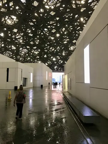 Louvre Abu Dhabi — Visitors explore the museum’s public spaces.