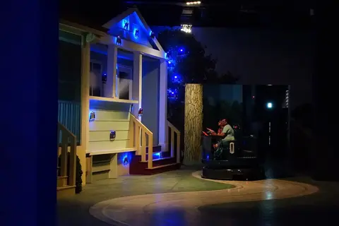 A themed indoor street and attraction façades at IMG Worlds