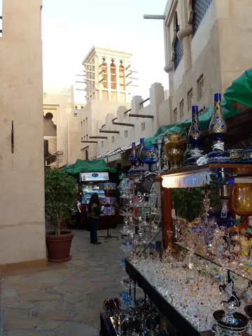 Shopfronts line a narrow pedestrian lane
