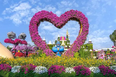 A heart-shaped floral arch in the garden