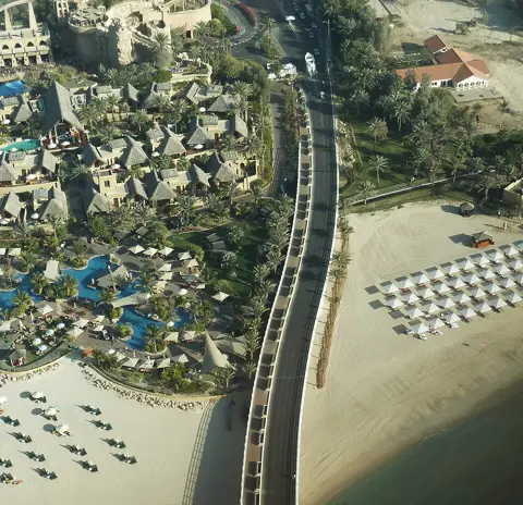 An elevated view of Wild Wadi’s slides, pools and beachside setting