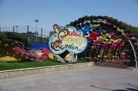 The entrance sign at Dubai Butterfly Garden, photographed in March 2020