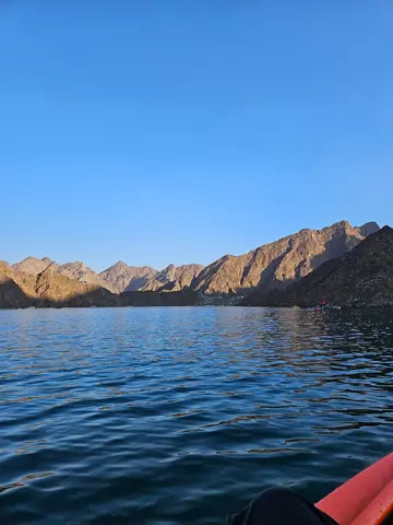 Blue water and rocky slopes viewed while kayaking